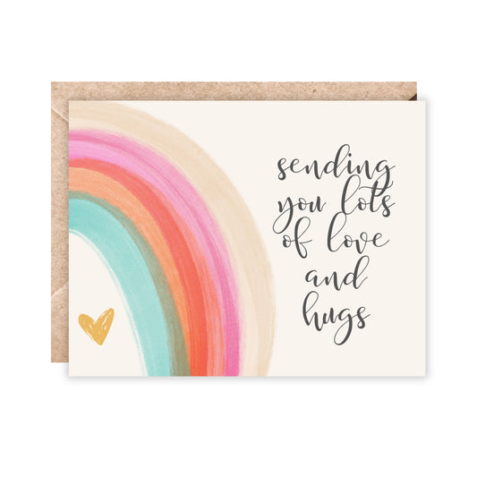 card with a rainbow that reads sending you lots of love and hugs