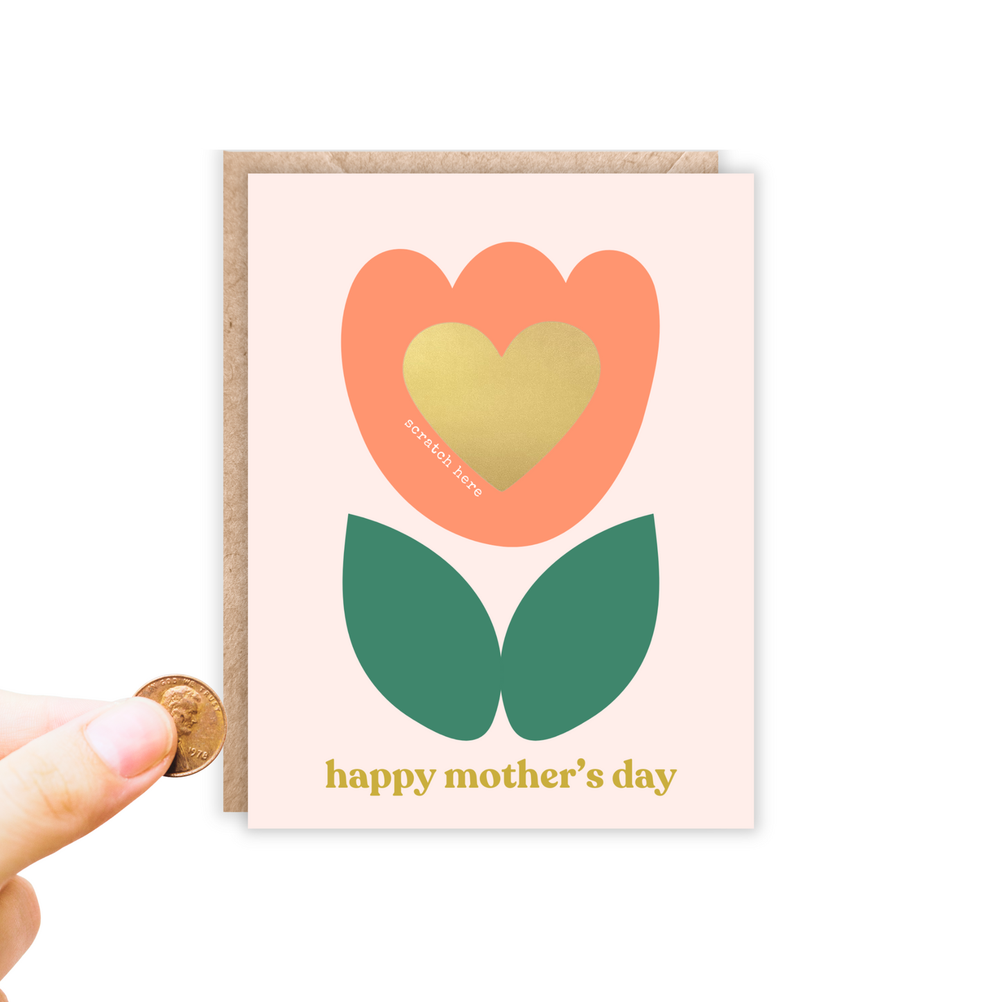 Greeting card in portrait size. Has a blush background with an abstract orange and green tulip and inside of the tulip is a gold heart scratch off sticker. Has a spot to write your message and then apply the sticker to scratch off.