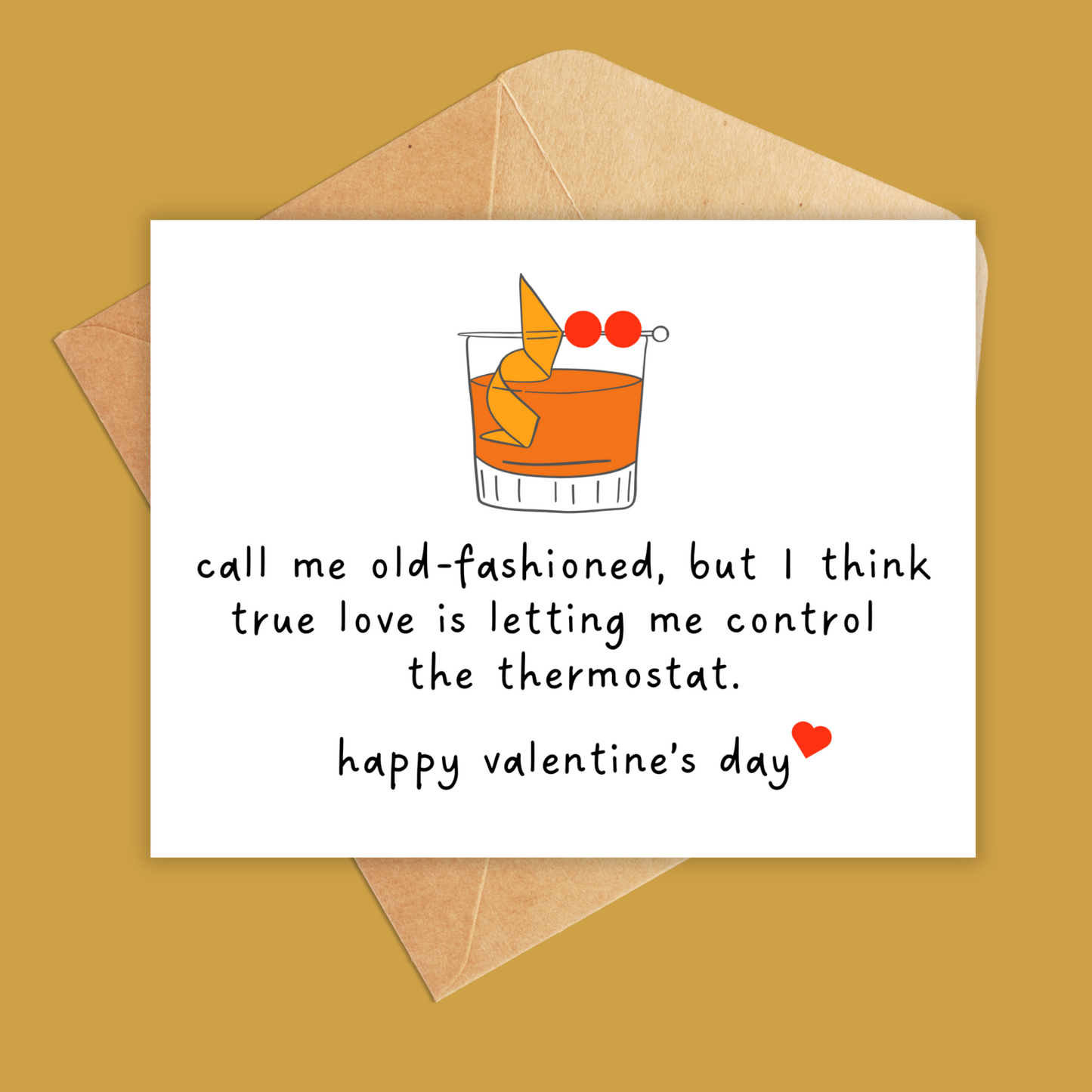 White landscape orientation greeting card with an animated old fashioned cocktail drink. Text underneath reads 'call me old fashioned but i think true love is letting me control the thermostat happy valentines day shown with a brown kraft envelope