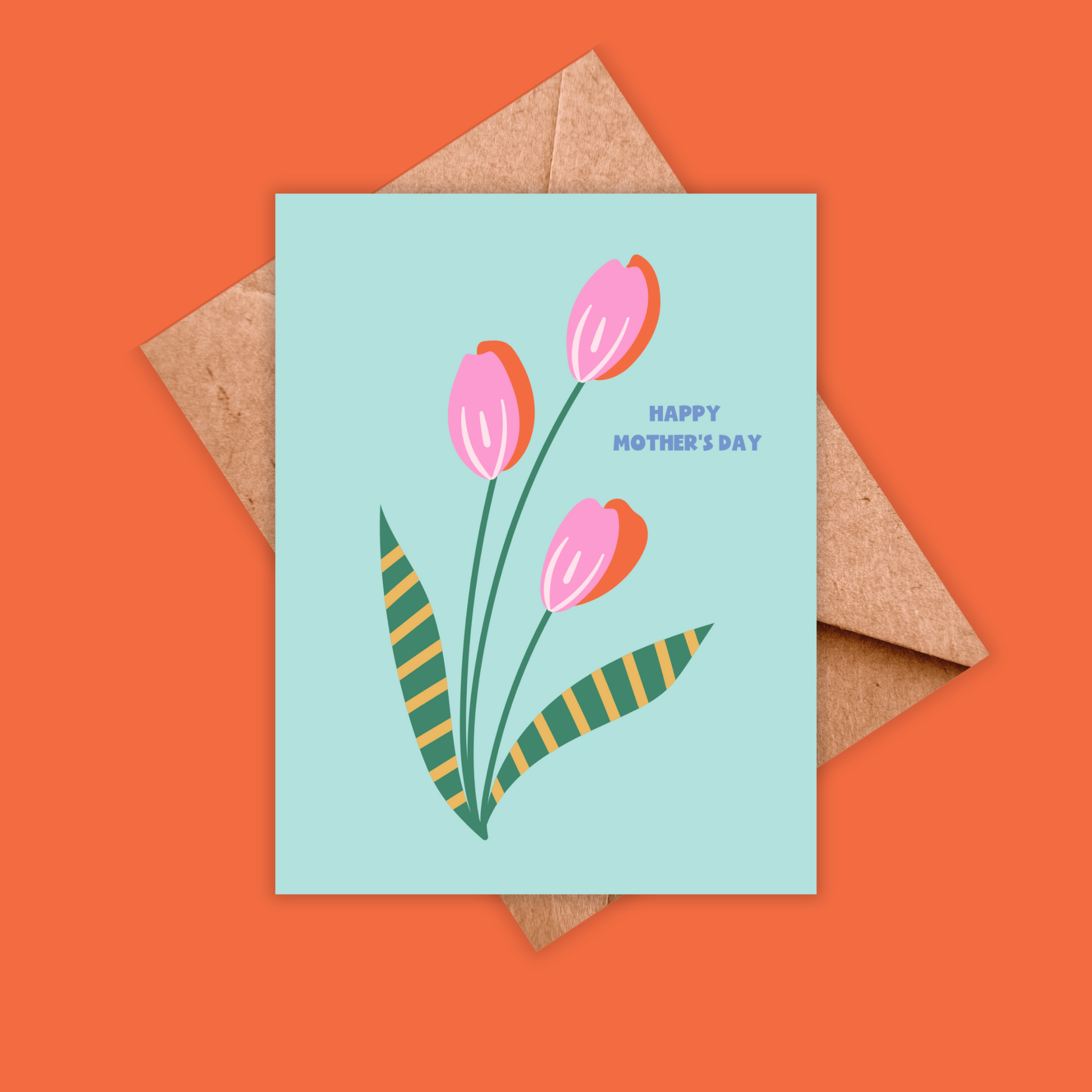 Greeting card with blue background and pink and orange tulips. Text reads Happy Mother's day. Shown with a brown kraft envelope