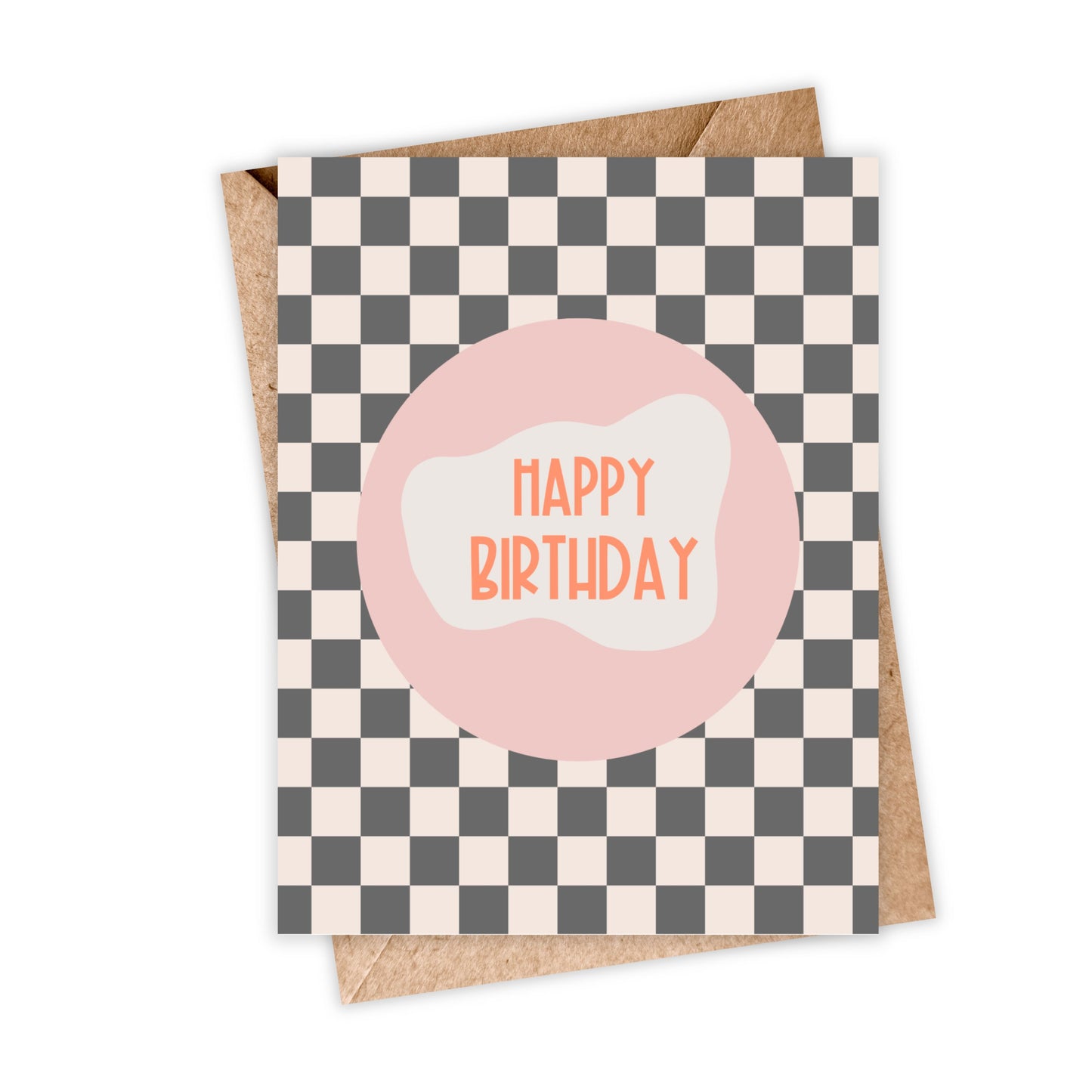 mockup of greeting card in black and white checkered background with pink circle in the middle with happy birthday in orange