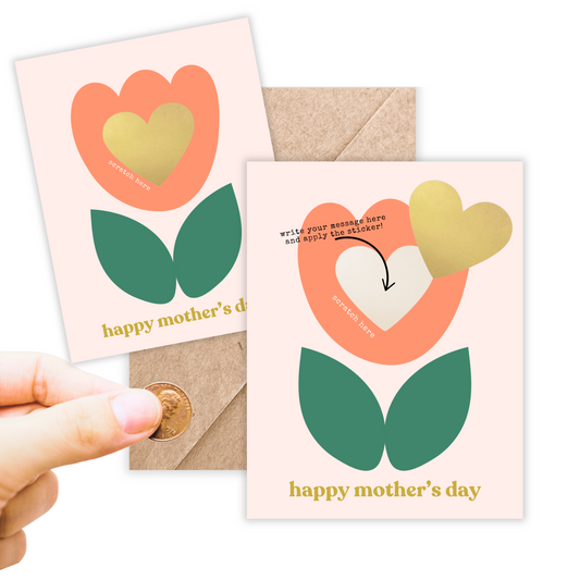 Greeting card in portrait size. Has a blush background with an abstract orange and green tulip and inside of the tulip is a gold heart scratch off sticker. Has a spot to write your message and then apply the sticker to scratch off.