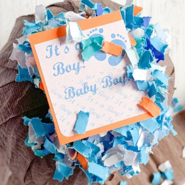 pumpkin gender reveal surprise ball revealing it's a boy tag with blue confetti